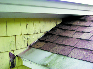 A “kick-out” at the bottom of the roof would prevent the saturation of the siding.