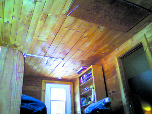 Tongue-and-groove ceiling below a flat attic. 