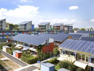 The Solar Settlement with the Sun Ship in the background: two PlusEnergy projects in Freiburg, Germany. Photo: Wikimedi.org