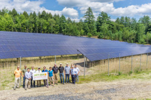 Net Zero Montpelier team members gather at the Log Rd 500-kW array in Montpelier, that was completed in 2017. Photo: John Snell