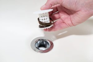 Simple devices like the TubShroom can trap hair before it gets into your drain and causes a back-up. Courtesy Image.
