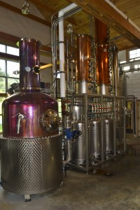 The ‘still’ in the production room with the copper columns and equipment used for the distilling process (make this pic quite big with the tasting room possibly as a partial inset.