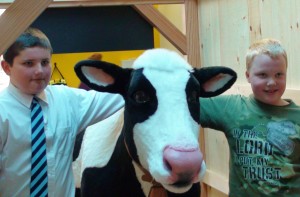 1.Jared McGee, a student at West Rutland Elementary School, and Dillon Brigham, a student at Danville School, both named EIC’s cow for their exhibit. Photo courtesy of Green Mountain Power. 